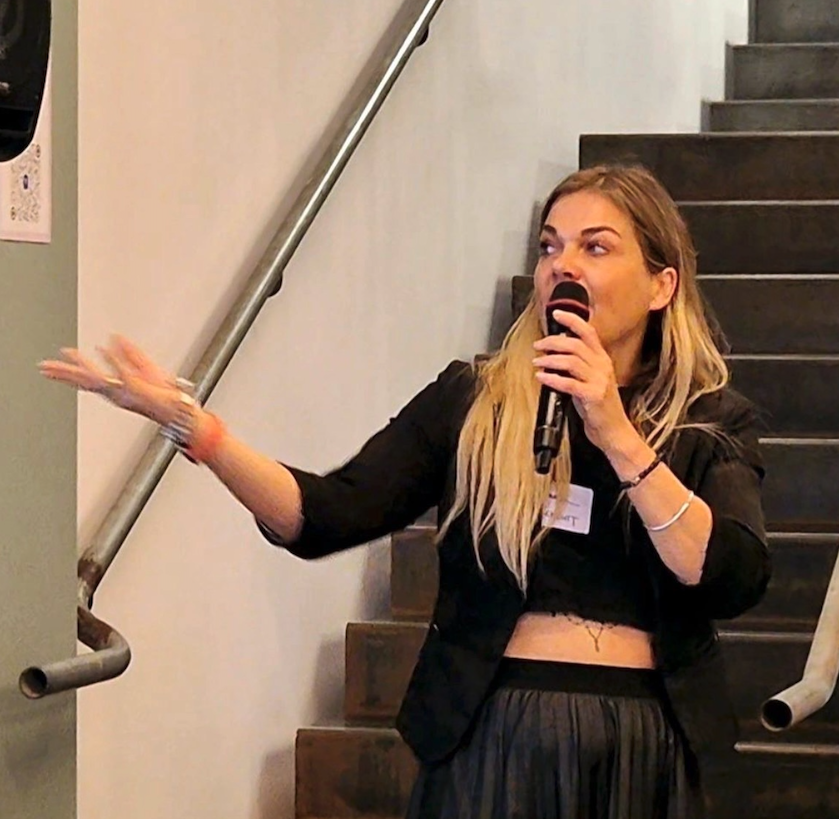 Hannah speaking with a microphone