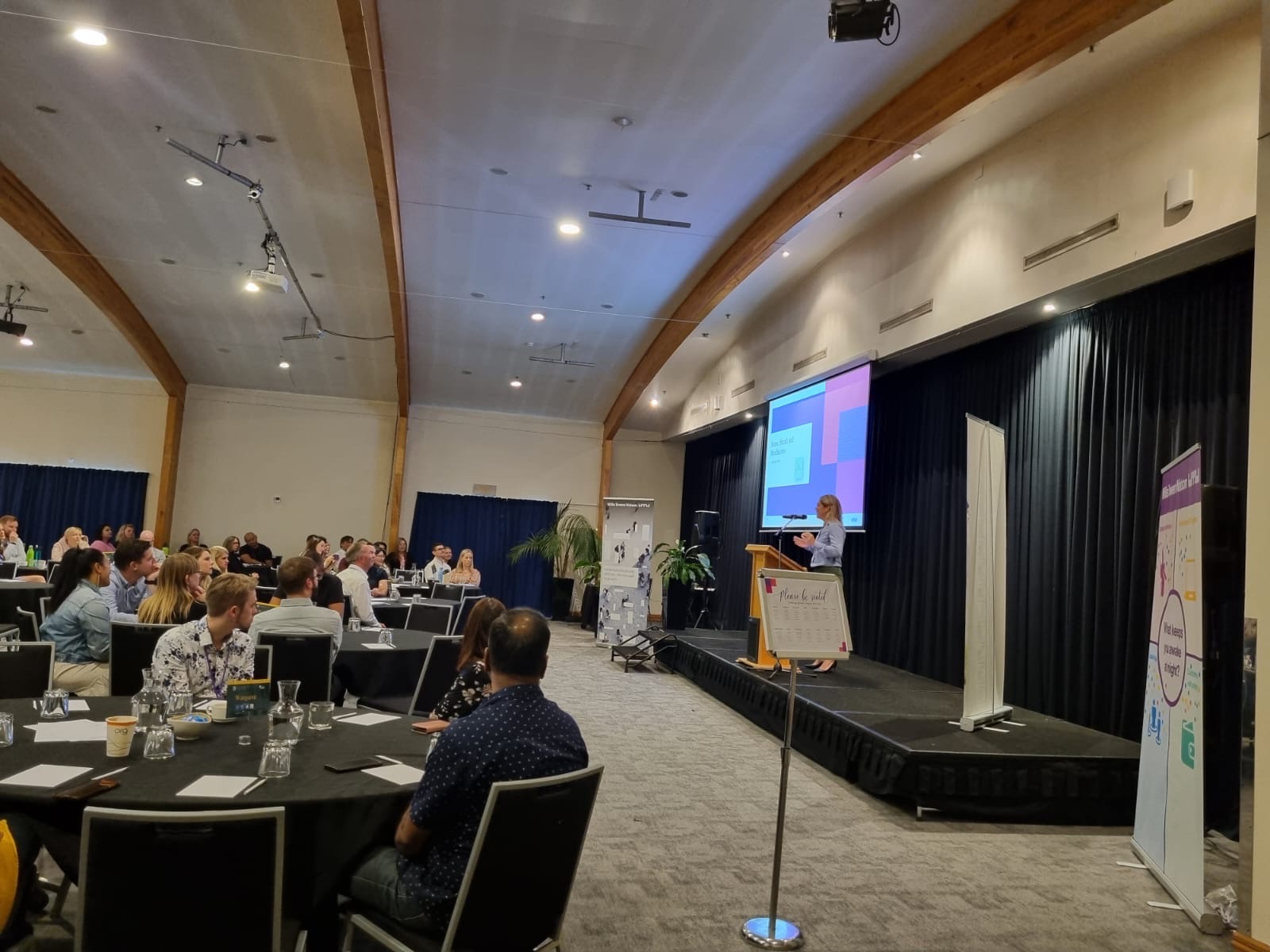 Hannah speaking at a conference
